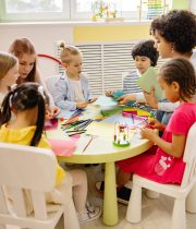 Children engaged in creative activities during an art class at a preschool, fostering learning and fun.